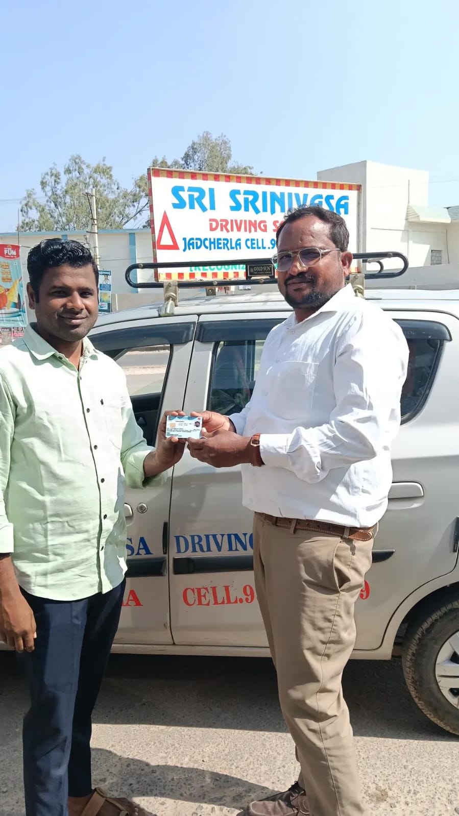 Student receiving driving course certificate